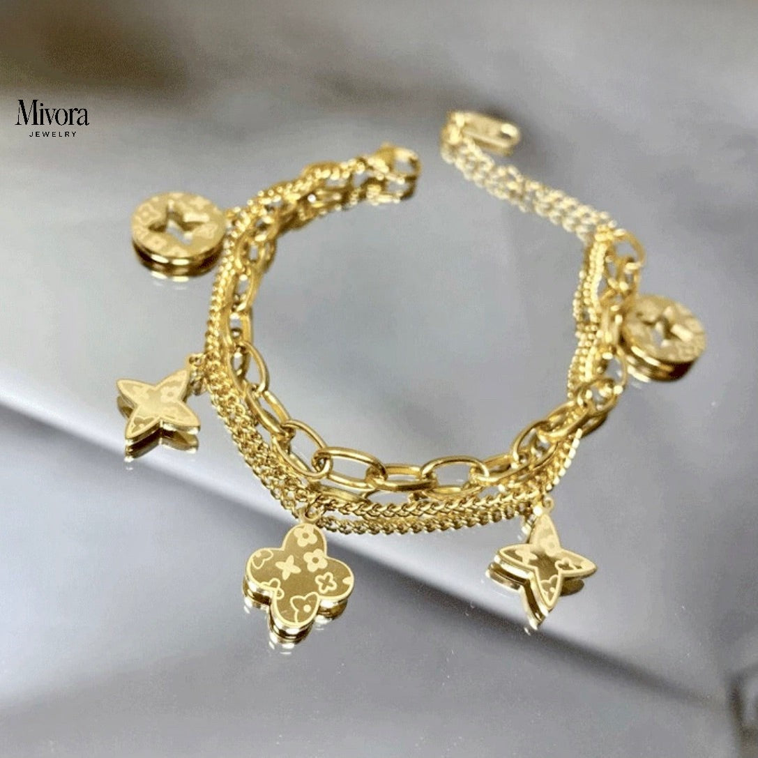 FOUR LEAF CLOVER CHARMS BRACELET - GOLD AND SILVER
